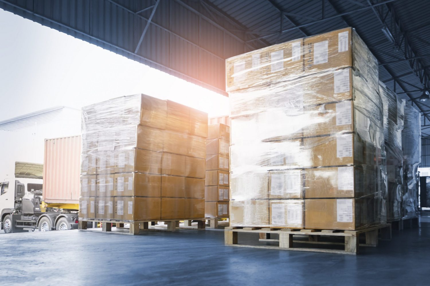Stacked of Package Boxes Loading into Container Truck. Truck Parked Loading at Dock Warehouse. Delivery Service. Shipping Warehouse Logistics. Shipment Freight Truck Transportation. Stacked of Package Boxes Loading into Container Truck. Truck Parked Loading at Dock Warehouse. Delivery Service. Shipping Warehouse Logistics. Shipment Freight Truck Transportation.